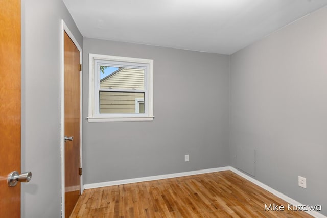 945 NW Dorothy St NW, Grand Rapids, MI 49504 - unfurnished room with wood finished floors and baseboards