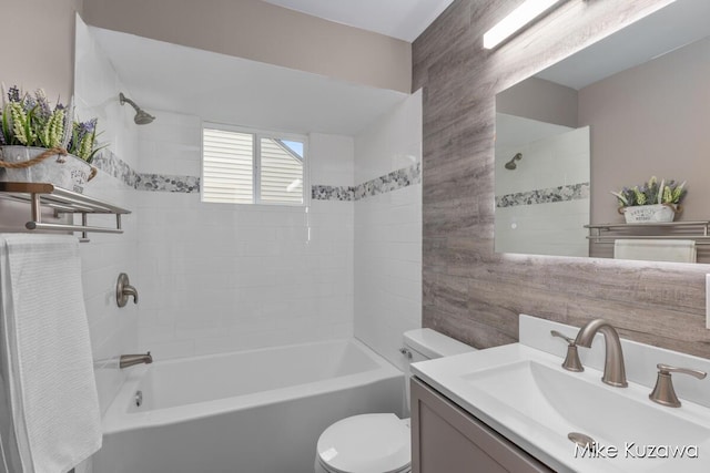 945 NW Dorothy St NW, Grand Rapids, MI 49504 - bathroom with toilet, vanity, and bathtub / shower combination