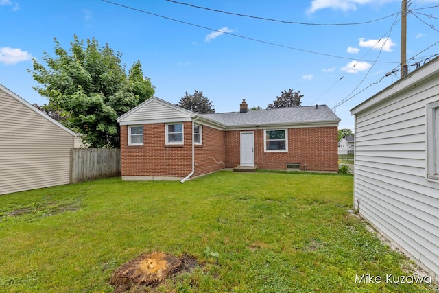 945 NW Dorothy St NW, Grand Rapids, MI 49504 - back of property with brick siding and a chimney