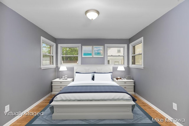 945 NW Dorothy St NW, Grand Rapids, MI 49504 - bedroom featuring wood finished floors and baseboards