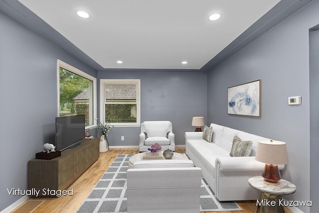 945 NW Dorothy St NW, Grand Rapids, MI 49504 - living room featuring wood finished floors, recessed lighting, and baseboards