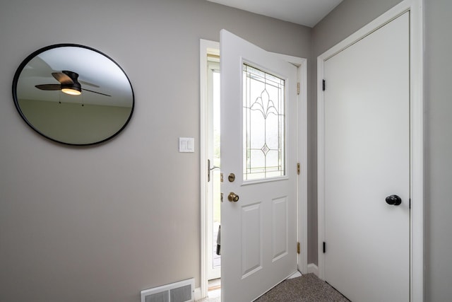 481 Gilson St, Coloma, MI 49038 - foyer with light colored carpet, ceiling fan, and baseboards