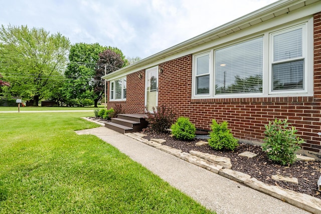 481 Gilson St, Coloma, MI 49038 - view of front of home with brick siding and a front yard