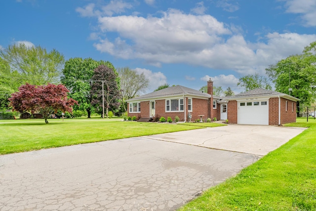 481 Gilson St, Coloma, MI 49038 - ranch-style home featuring a garage, a front yard, and brick siding