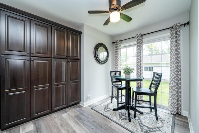 481 Gilson St, Coloma, MI 49038 - dining space featuring baseboards, light wood-type flooring, and a ceiling fan