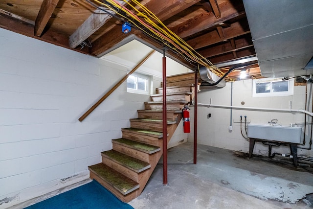 481 Gilson St, Coloma, MI 49038 - basement featuring stairway, concrete block wall, healthy amount of natural light, and a sink
