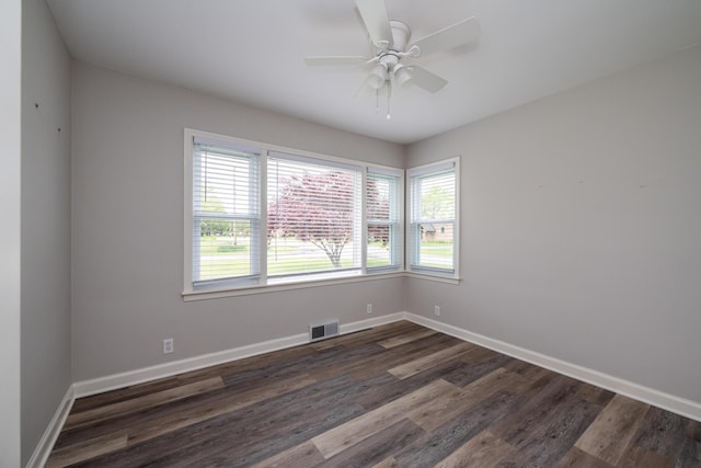 481 Gilson St, Coloma, MI 49038 - empty room with plenty of natural light, dark wood-style flooring, baseboards, and ceiling fan