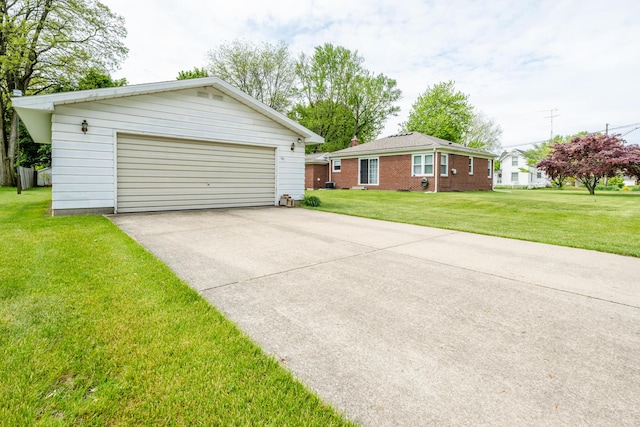 481 Gilson St, Coloma, MI 49038 - view of front of house featuring a garage, a front yard, and an outbuilding