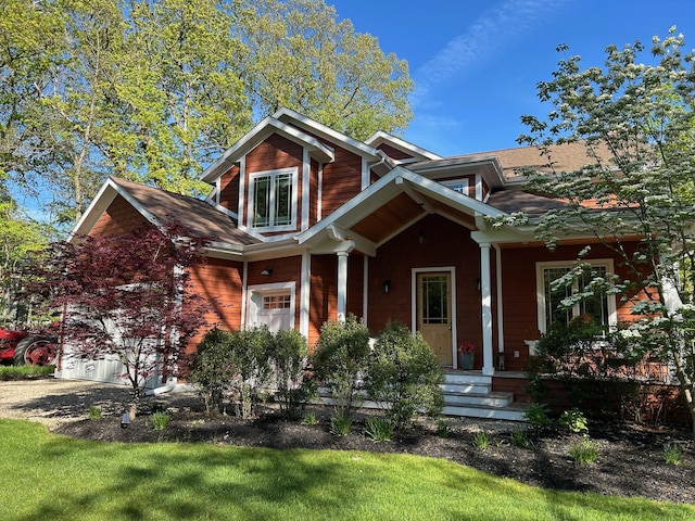 46306 Station Rd, New Buffalo, MI 49117 - view of front of property with a garage, a porch, and driveway