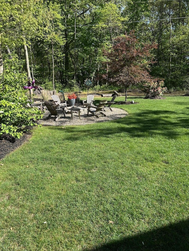 46306 Station Rd, New Buffalo, MI 49117 - view of grassy yard featuring a fire pit