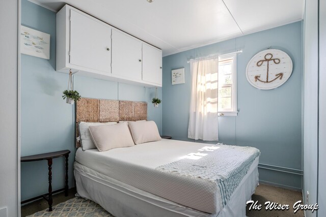 1261 W Channel St, Bitely, MI 49309 - carpeted bedroom featuring crown molding