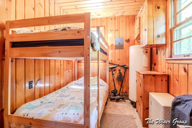 1261 W Channel St, Bitely, MI 49309 - bedroom with wooden walls, carpet flooring, and wood ceiling