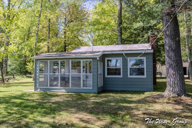 1261 W Channel St, Bitely, MI 49309 - view of outbuilding featuring a sunroom