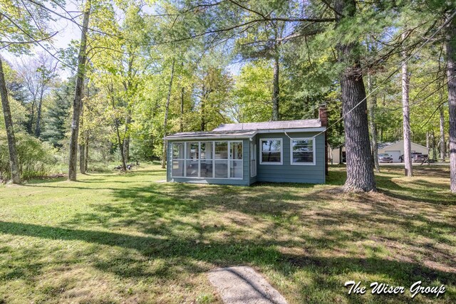 1261 W Channel St, Bitely, MI 49309 - view of outbuilding with a sunroom