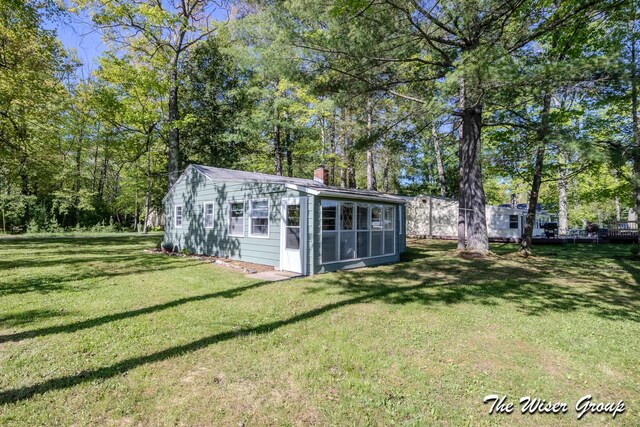 1261 W Channel St, Bitely, MI 49309 - view of outbuilding with a sunroom