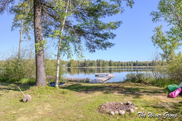1261 W Channel St, Bitely, MI 49309 - dock area featuring a water view and a forest view