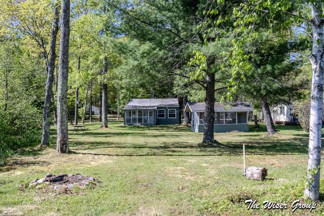 1261 W Channel St, Bitely, MI 49309 - view of front of house featuring a front yard