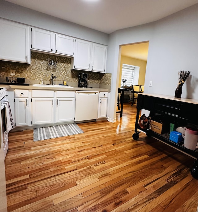 44750 Erin Dr, Plymouth, MI 48170 - kitchen featuring white dishwasher, a sink, and white cabinets