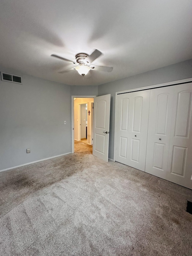 44750 Erin Dr, Plymouth, MI 48170 - unfurnished bedroom featuring carpet, baseboards, a closet, and ceiling fan