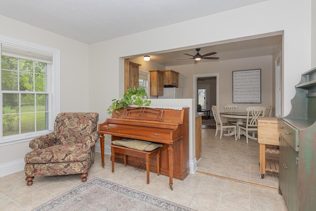 7610 W Kl Ave, Kalamazoo, MI 49009 - living area featuring ceiling fan and baseboards