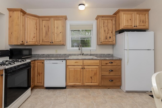 7610 W Kl Ave, Kalamazoo, MI 49009 - kitchen with white appliances, a sink, and dark countertops