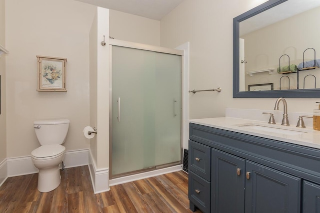 7610 W Kl Ave, Kalamazoo, MI 49009 - full bath with a stall shower, vanity, wood finished floors, and toilet
