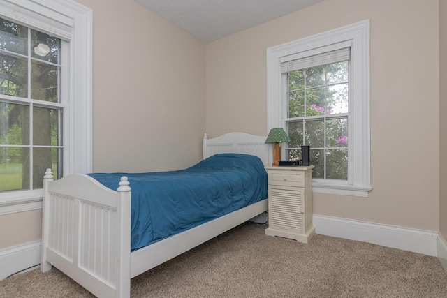 7610 W Kl Ave, Kalamazoo, MI 49009 - bedroom featuring carpet and baseboards