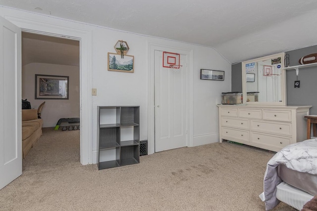 7610 W Kl Ave, Kalamazoo, MI 49009 - bedroom featuring lofted ceiling and light carpet