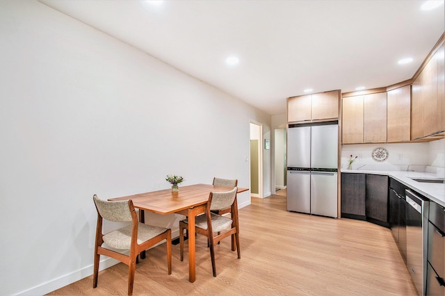 515 Springfield Cir, Niles, MI 49120 - kitchen featuring stainless steel appliances, light countertops, baseboards, light wood-type flooring, and recessed lighting