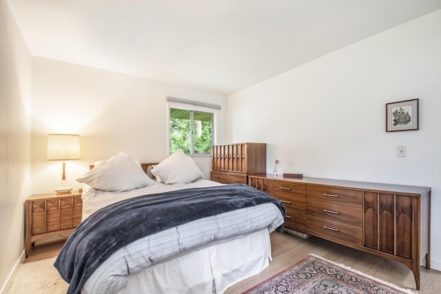 515 Springfield Cir, Niles, MI 49120 - bedroom with wood finished floors, baseboards, and lofted ceiling