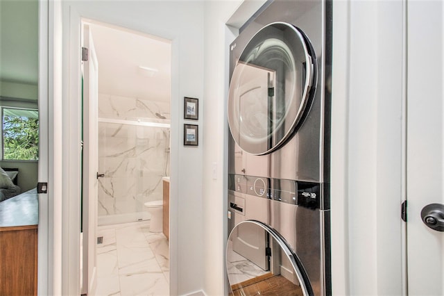 515 Springfield Cir, Niles, MI 49120 - washroom featuring stacked washer and clothes dryer and marble finish flooring