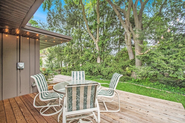 515 Springfield Cir, Niles, MI 49120 - wooden terrace with outdoor dining area and view of wooded area