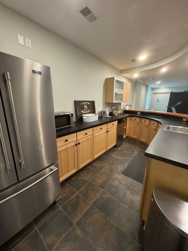 8460 Woodridge Dr, Davison, MI 48423 - kitchen featuring appliances with stainless steel finishes, light brown cabinetry, a sink, and dark countertops