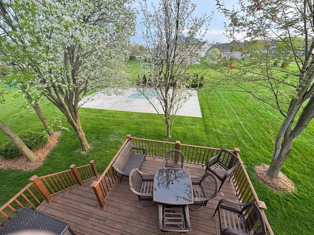 8460 Woodridge Dr, Davison, MI 48423 - wooden terrace with outdoor dining area, a yard, and an outdoor pool