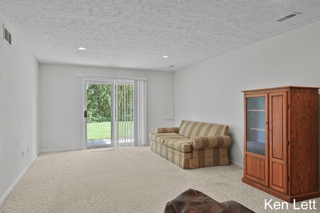 936 Amber View Dr SW Unit 160, Byron Center, MI 49315 - carpeted living area with a textured ceiling, baseboards, and recessed lighting