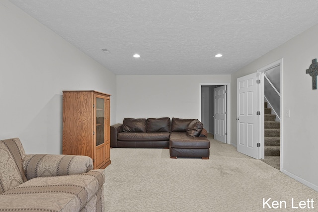 936 Amber View Dr SW Unit 160, Byron Center, MI 49315 - living room with light colored carpet, recessed lighting, stairs, a textured ceiling, and baseboards