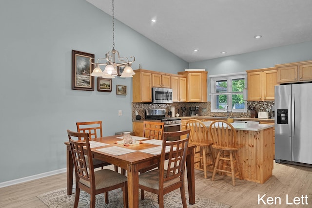 936 Amber View Dr SW Unit 160, Byron Center, MI 49315 - dining space featuring light wood-type flooring, a chandelier, recessed lighting, high vaulted ceiling, and baseboards
