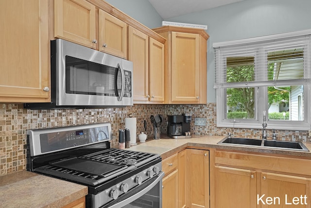 936 Amber View Dr SW Unit 160, Byron Center, MI 49315 - kitchen featuring appliances with stainless steel finishes, a sink, decorative backsplash, light brown cabinets, and light countertops