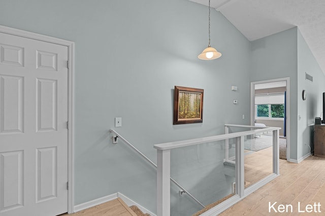 936 Amber View Dr SW Unit 160, Byron Center, MI 49315 - stairway with wood finished floors, baseboards, and high vaulted ceiling
