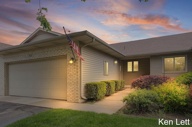 936 Amber View Dr SW Unit 160, Byron Center, MI 49315 - view of front facade featuring brick siding, driveway, a garage, and a shingled roof