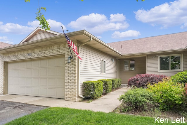 936 Amber View Dr SW Unit 160, Byron Center, MI 49315 - view of side of home featuring an attached garage, driveway, brick siding, and roof with shingles