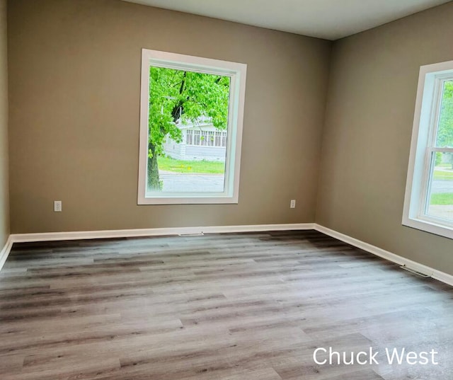 1479 Terrace St, Muskegon, MI 49442 - unfurnished room featuring baseboards and wood finished floors