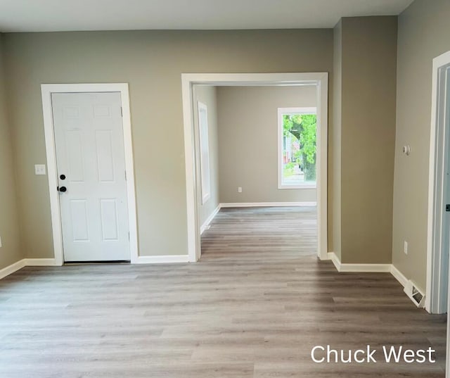 1479 Terrace St, Muskegon, MI 49442 - hallway with baseboards and wood finished floors