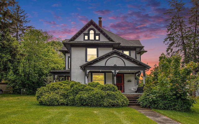 110 N O Keefe St, Cassopolis, MI 49031 - victorian-style house with covered porch, a front lawn, and a chimney