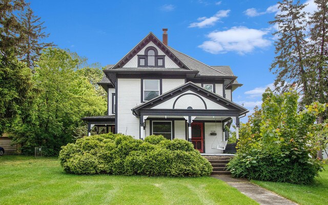 110 N O Keefe St, Cassopolis, MI 49031 - victorian house with a porch, a front yard, and a chimney
