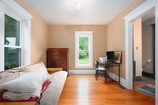 110 N O Keefe St, Cassopolis, MI 49031 - bedroom with light wood-style floors, an office area, and baseboards