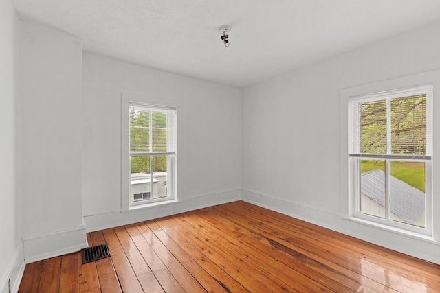 8001 S Jackson Rd, Jackson, MI 49201 - empty room with wood-type flooring and baseboards