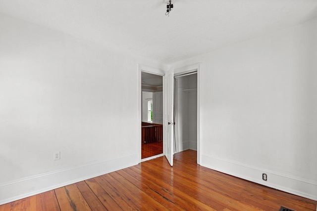8001 S Jackson Rd, Jackson, MI 49201 - empty room featuring wood-type flooring and baseboards