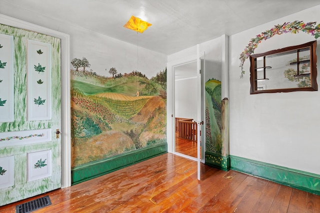 8001 S Jackson Rd, Jackson, MI 49201 - spare room with hardwood / wood-style floors and baseboards