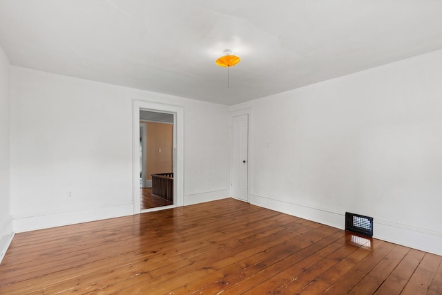 8001 S Jackson Rd, Jackson, MI 49201 - unfurnished room with hardwood / wood-style flooring and baseboards